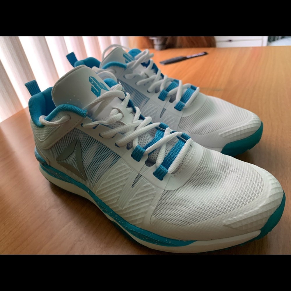 Reebok, very lightly worn.